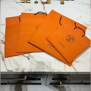 Hermès Signature Orange Bag with Black Handles